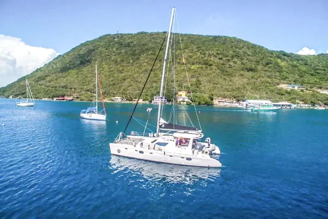 Moonstruck at anchor in a green-sided bay